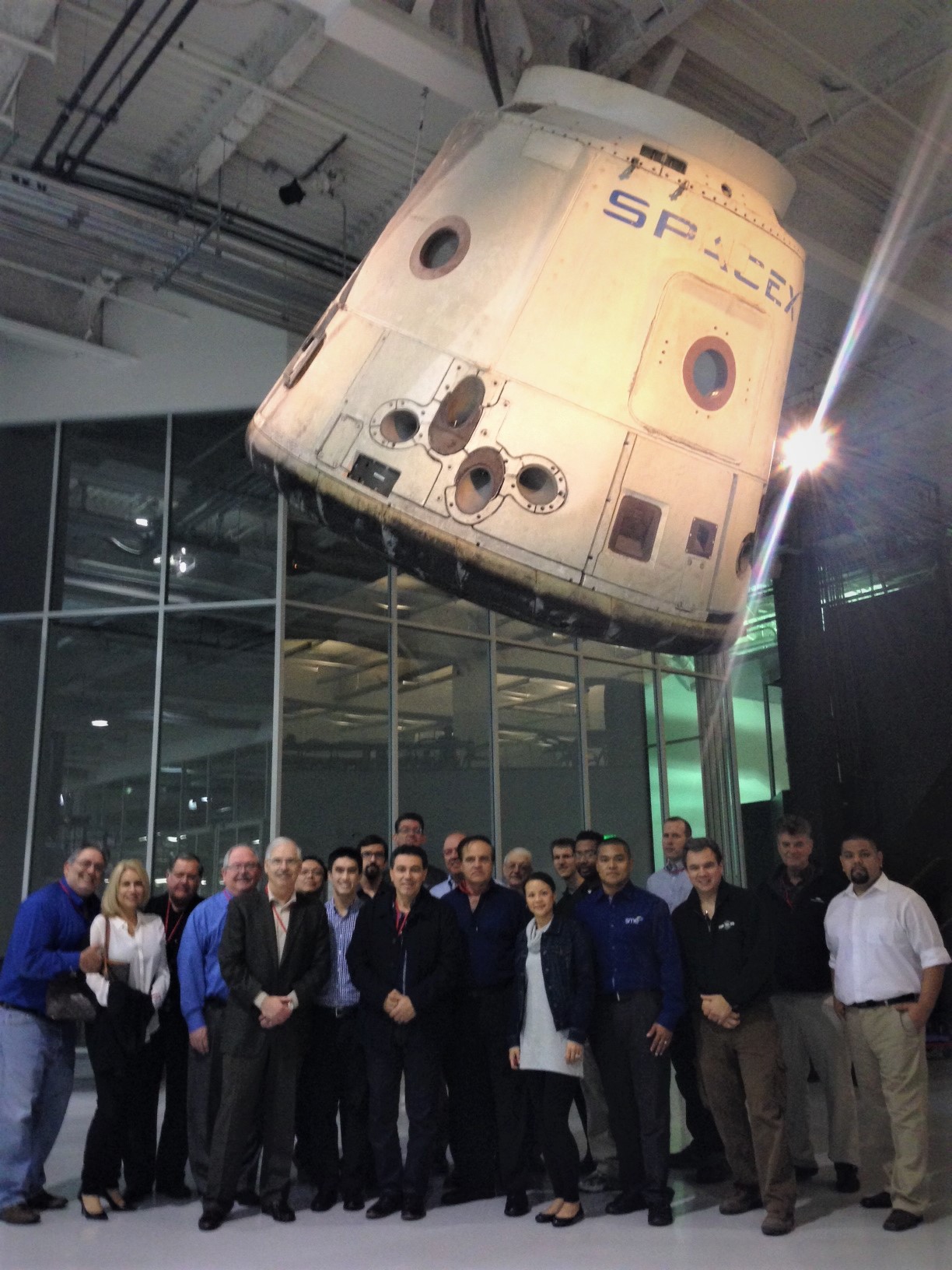 A group of men and women visiting SpacX company