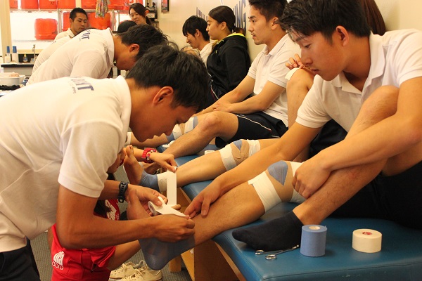 Japanese student learning taping technique