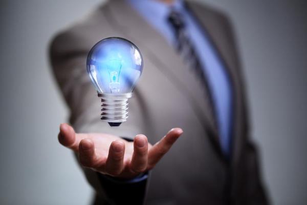 Businessman with a light bulb in his hand