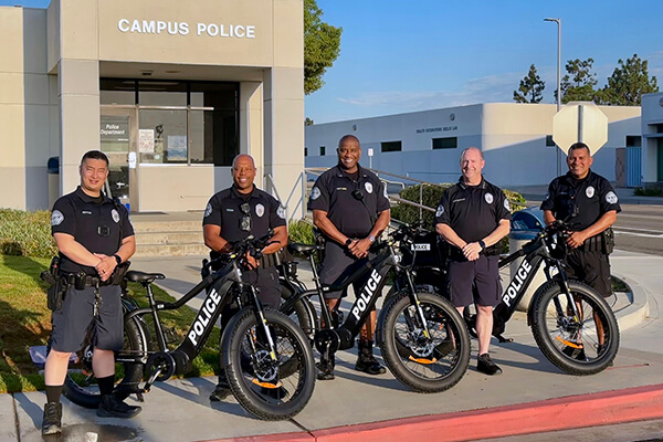 Campus Police officers with e-bikes