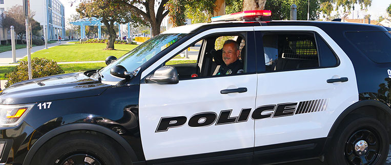 Police Officer in Police vehicle