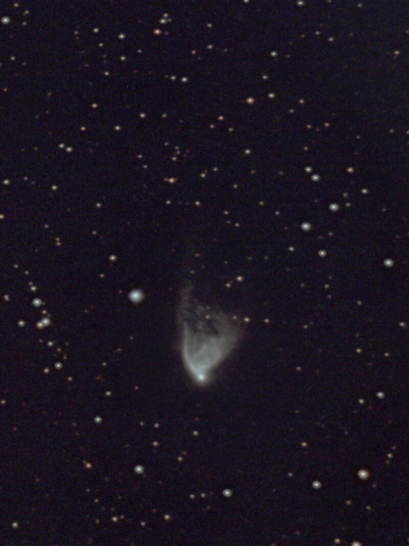 NGC 2261 appears as a bluish region that fans upward like a comet