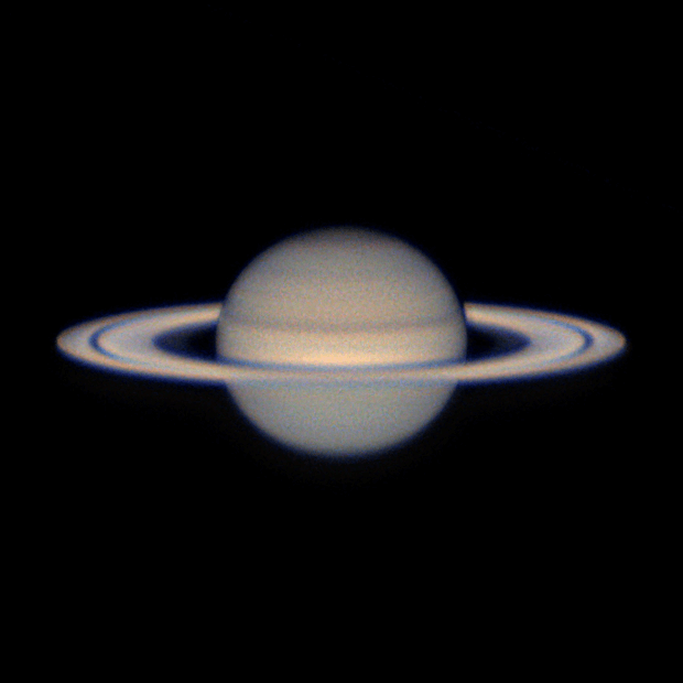 Saturn with its rings partially open to view