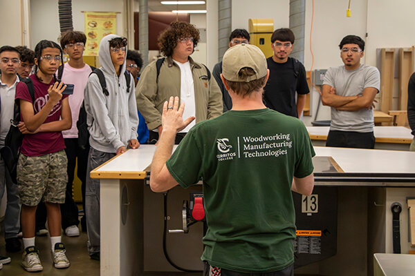 Visitors touring the woodworking shop