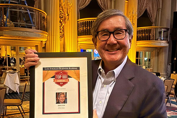 Charles Osaki with the award