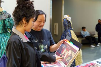 Professor and community member in costume studio