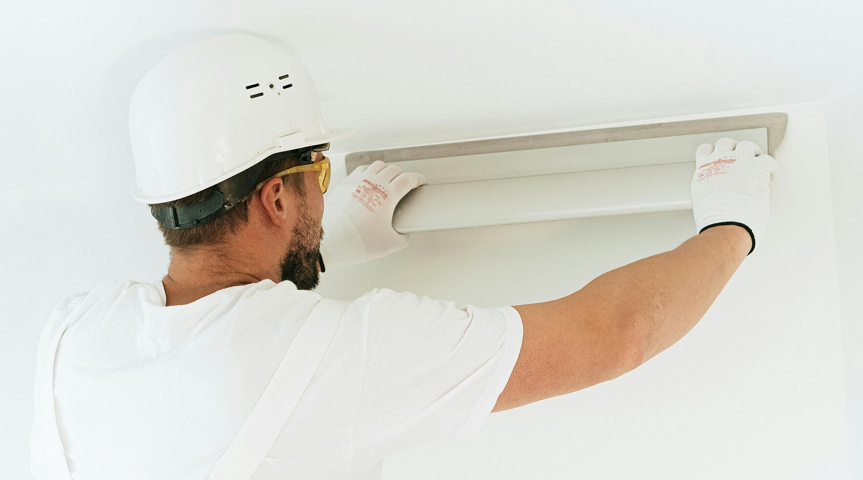Electrician putting in a light