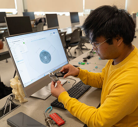 Engineering Design Technology Student with instructor