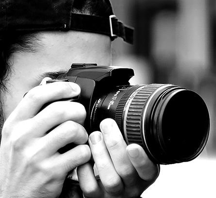 Individual taking a picture with a camera