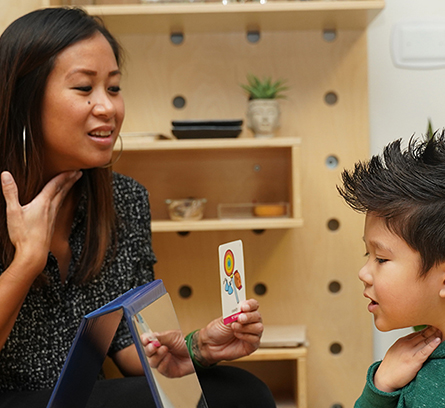 Female instructor teaching a child