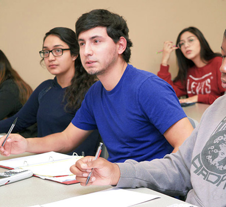 Students listening to instructor in class