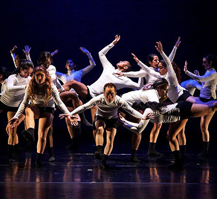Student dancers performing on a stage