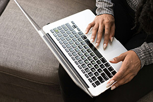 Individual working with a notebook computer
