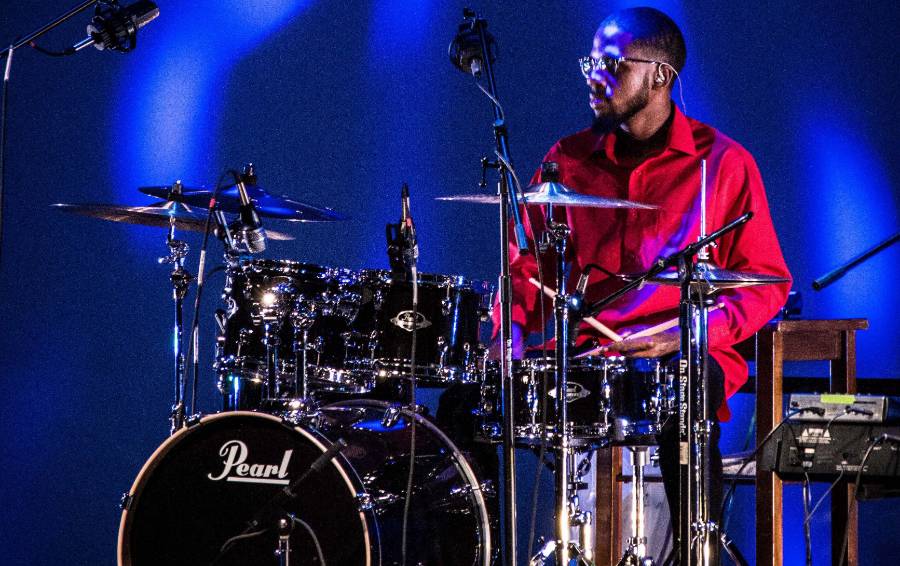 drummer on stage with blue lighting