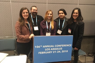 Professors and students at conference