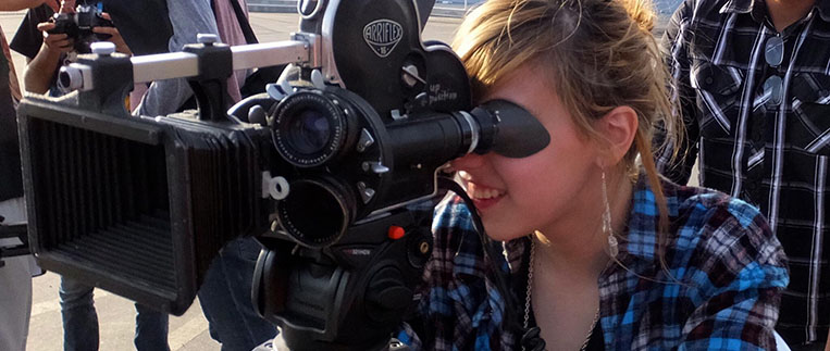 Student using a camcorder to film