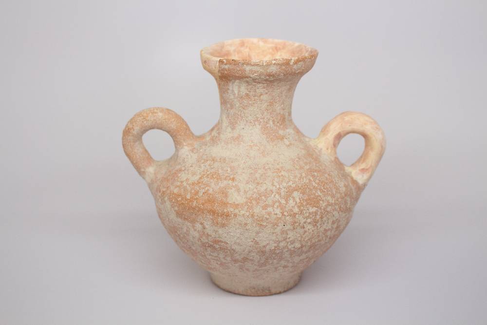 Small amphora with medium length neck and two handles on its body.