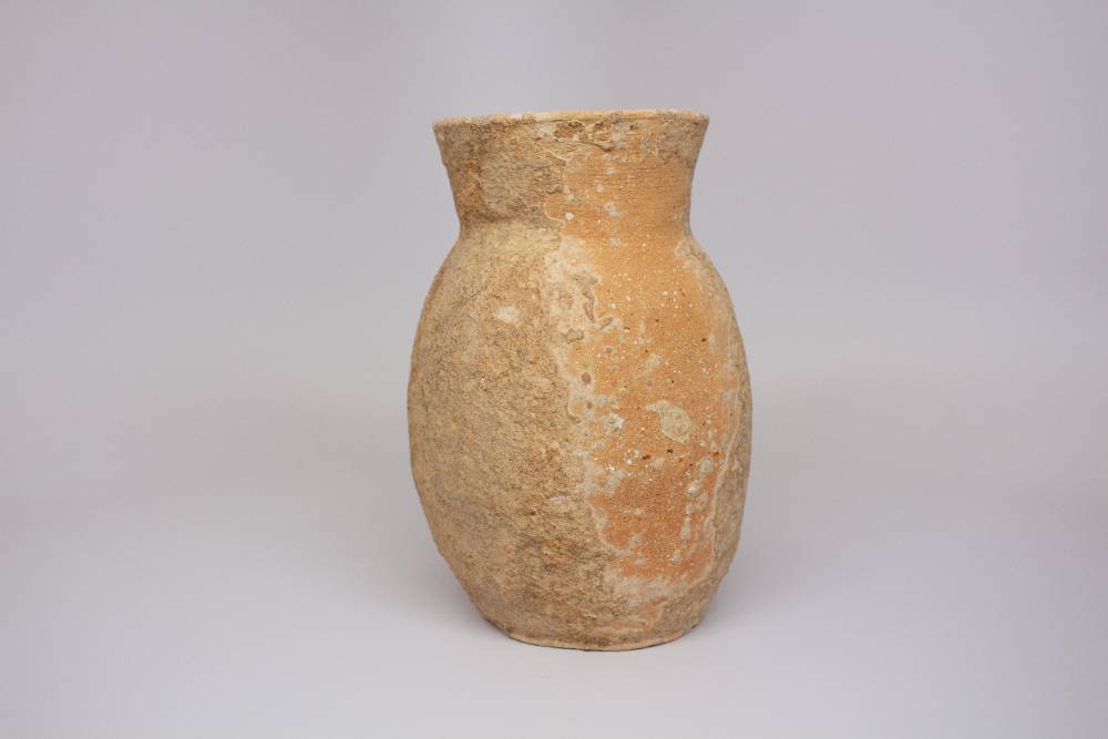 Brown ceramic vase.