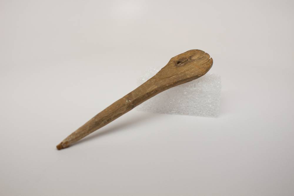 Wooden spoon with pointy tip. 