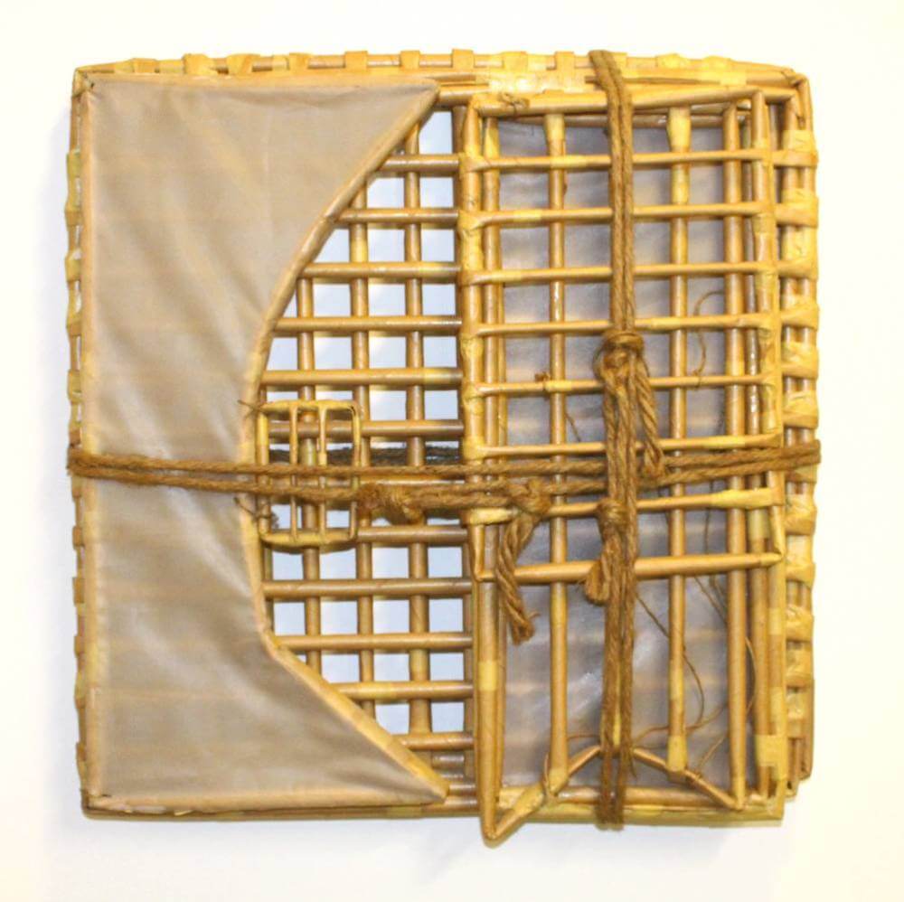 Rectangular sculptures made of desaturated yellow-colored paper, mesh, and tape.
