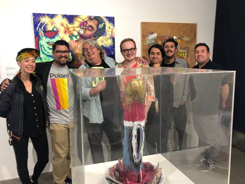 Artists Pose with their work from the Queer Art Collection