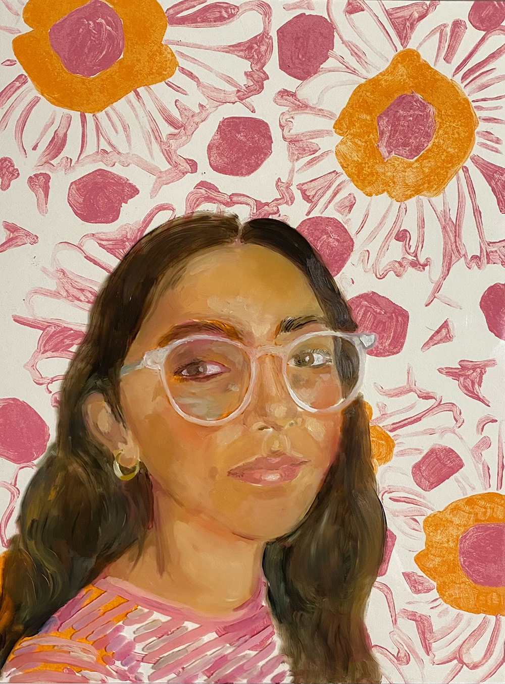 A young girl with glasses and pink floral background.