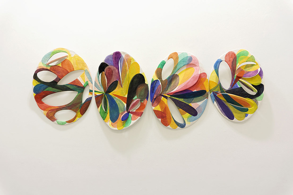 Four oval shaped abstract sculptures 