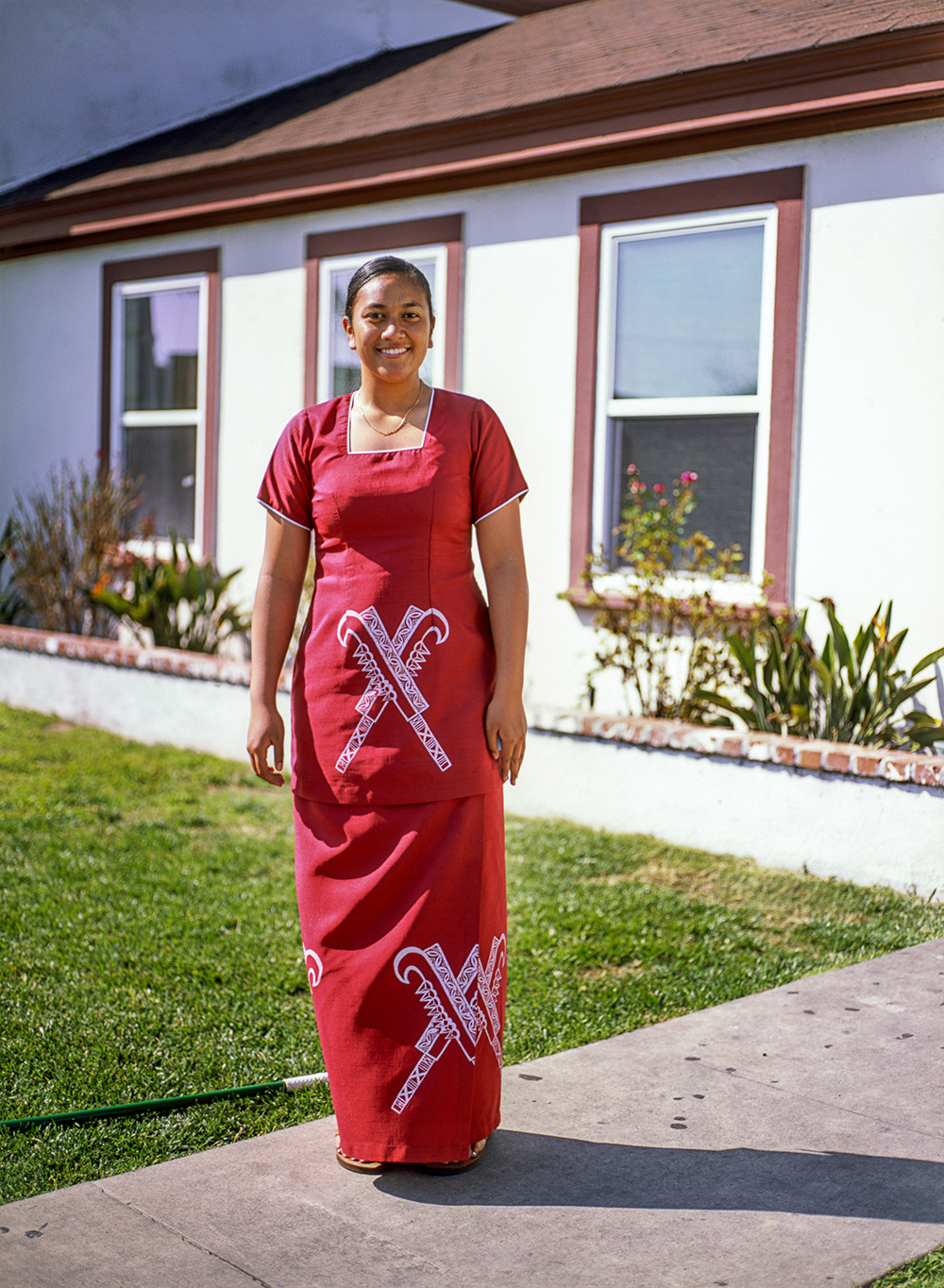 A Young Woman in Front of a House