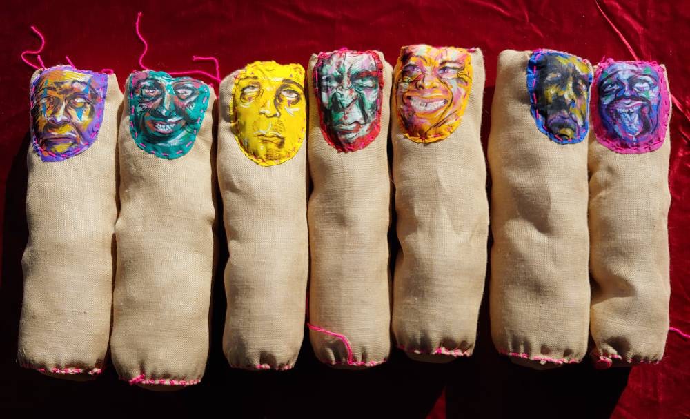 Seven Burlap Sacks with Painted Faces