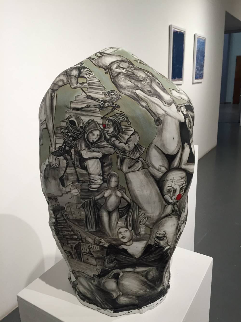 Ceramic sculpture with drawing on it
