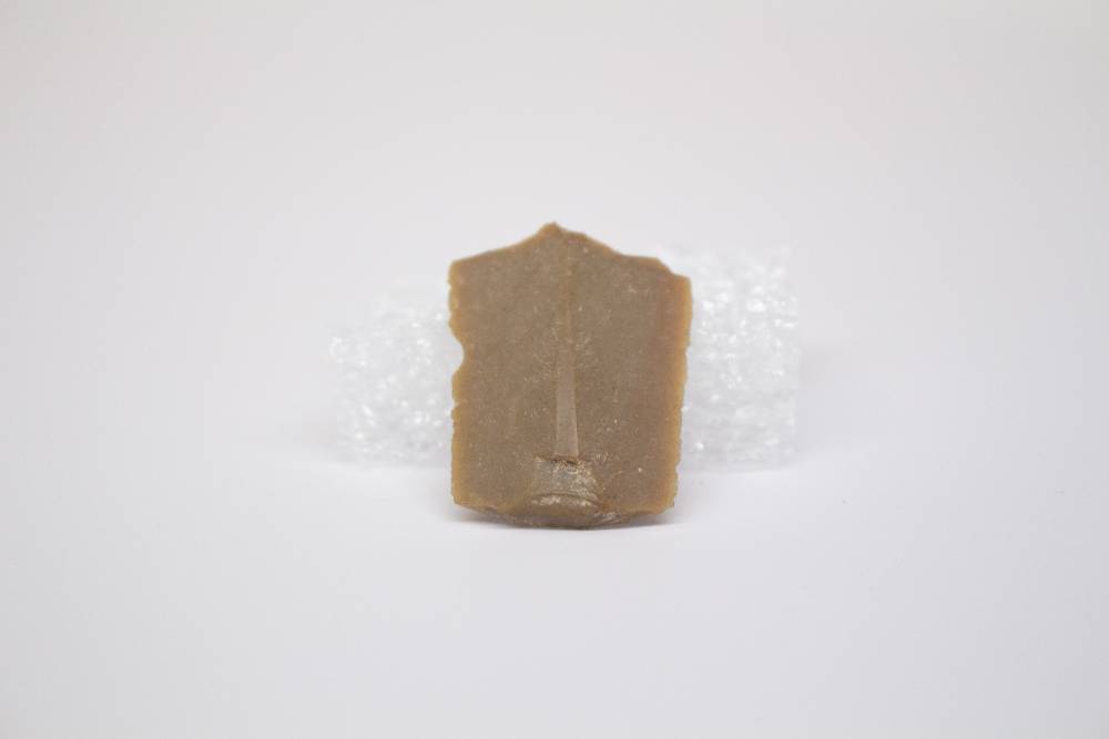 Semi-flat desaturated brown tool with beveled edges.