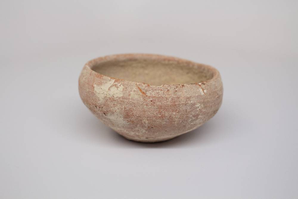 Ceramic bowl with faded color.