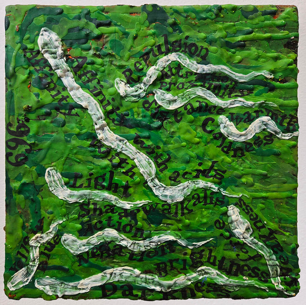 White snakes against green background and black text.