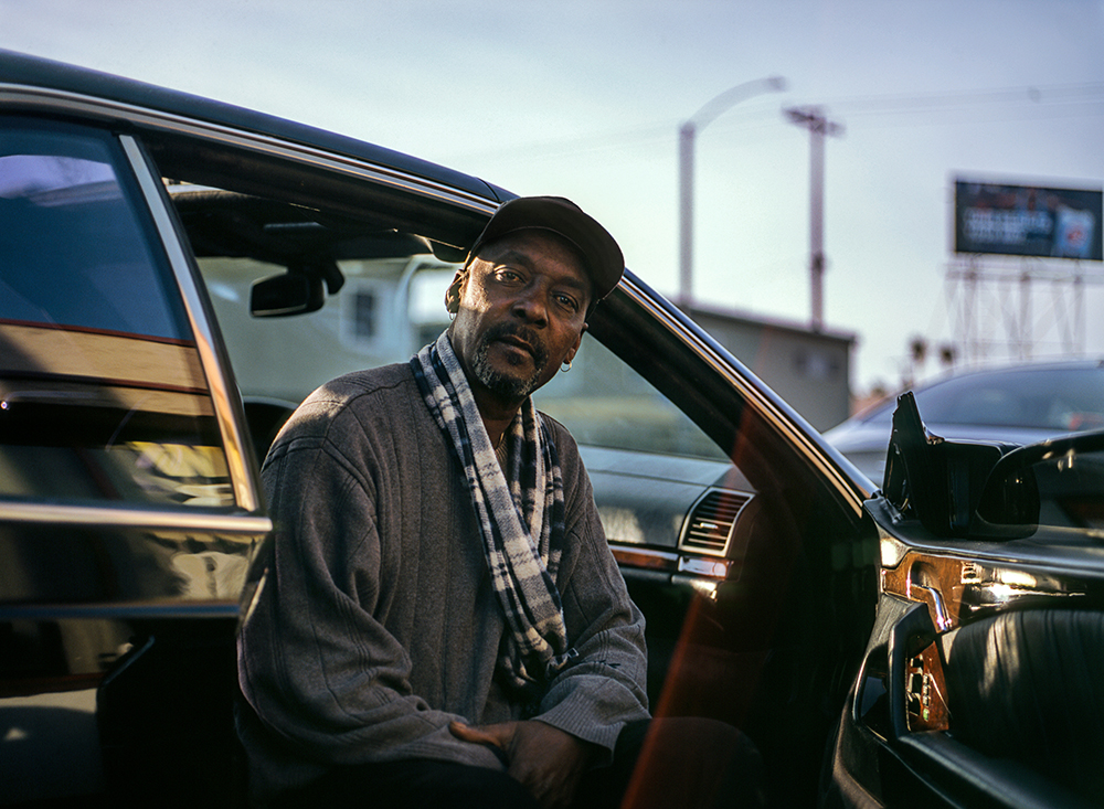 A man sitting in his car