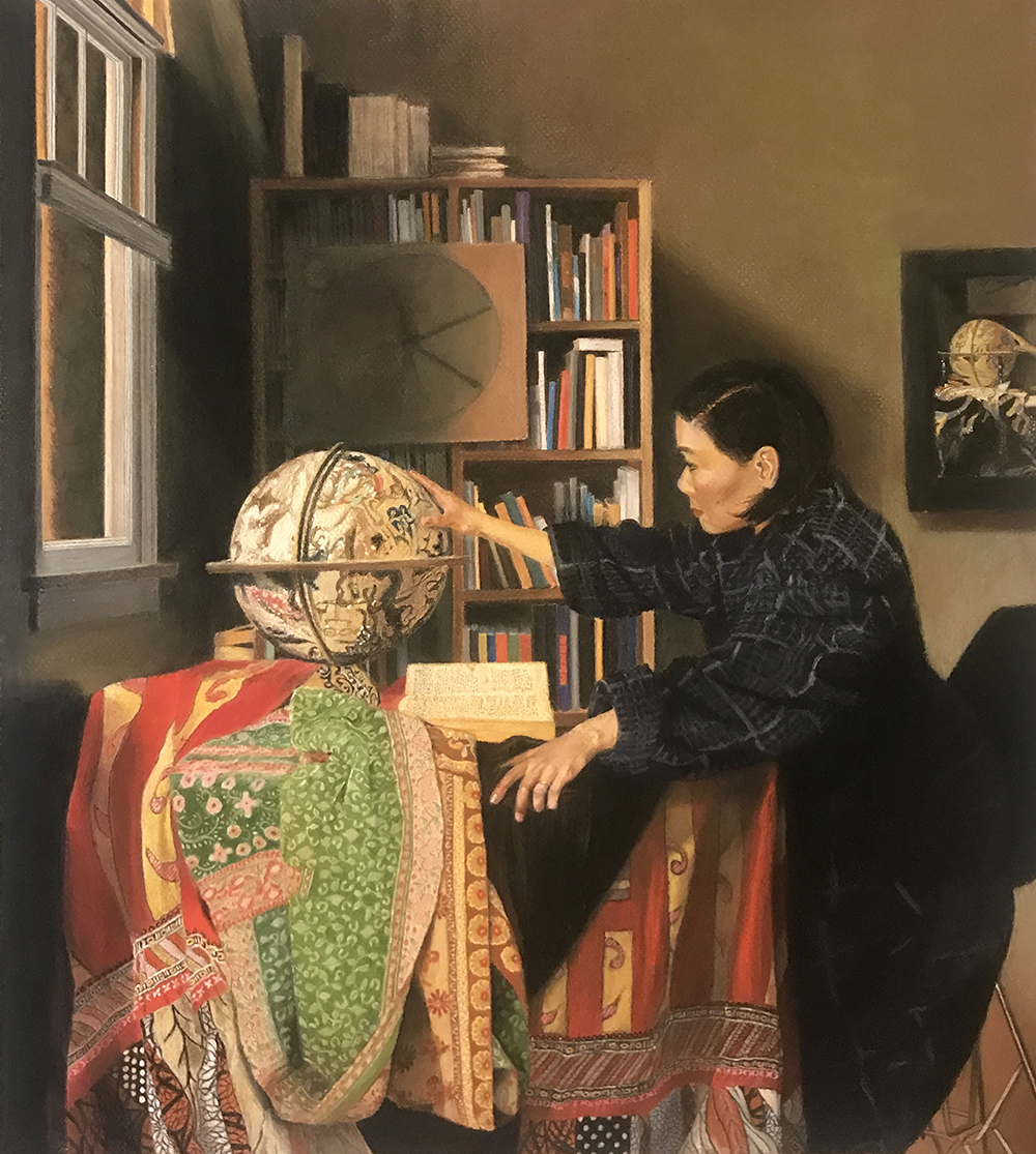 An asian woman with a globe in a room