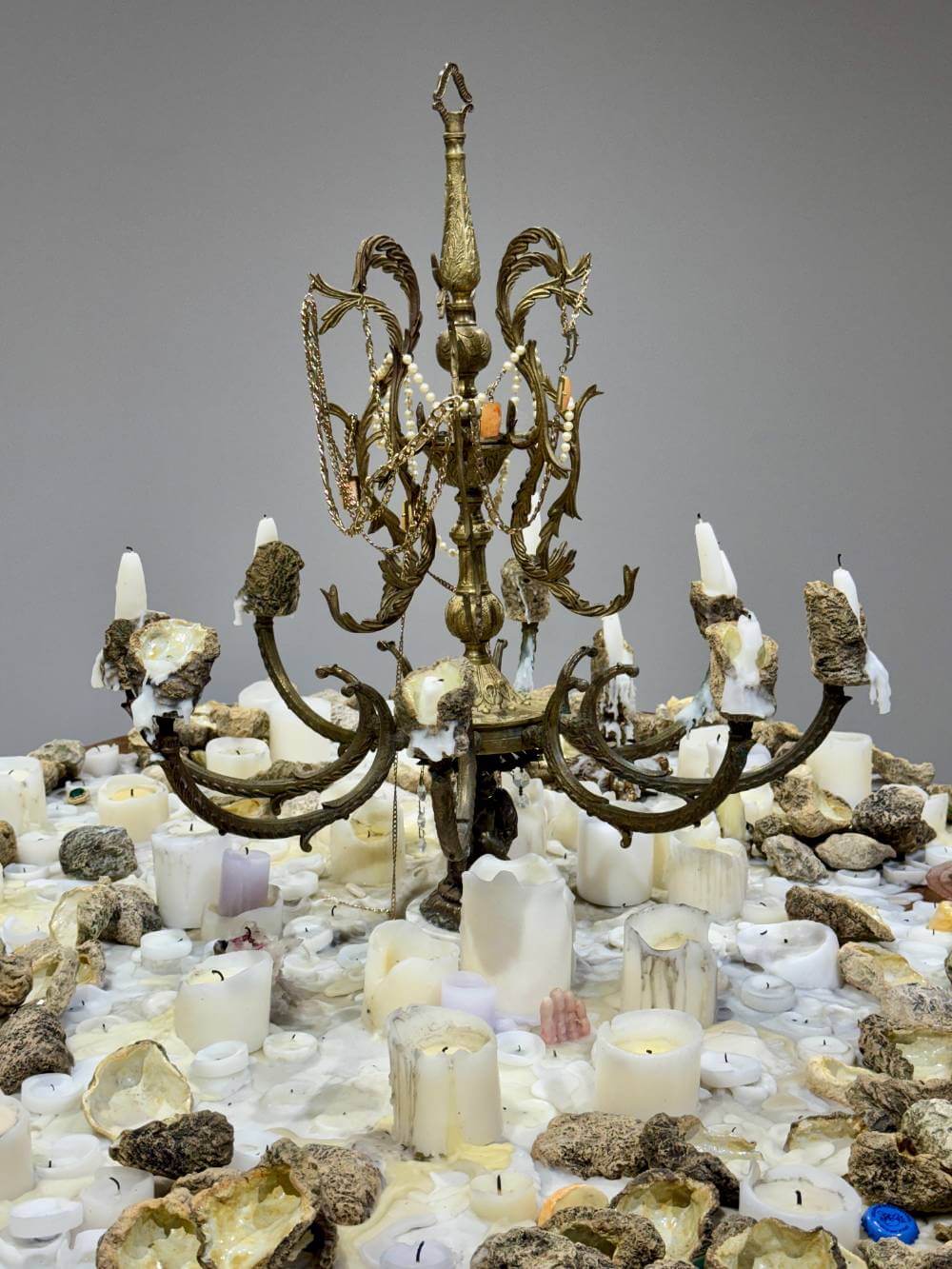 A table with oysters and burnt candles