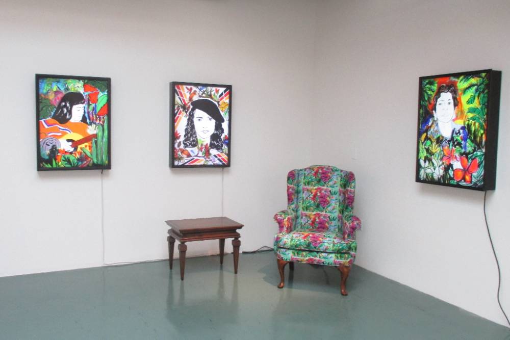 Sofa, a tv, and paintings.
