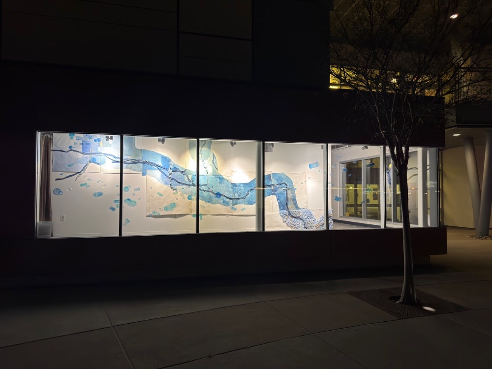illuminated window with artwork from liquid architecture