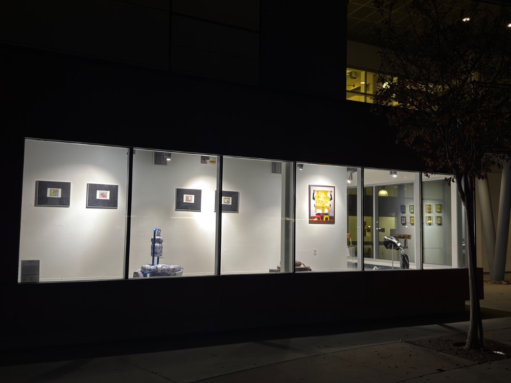 illuminated window with artwork from posture