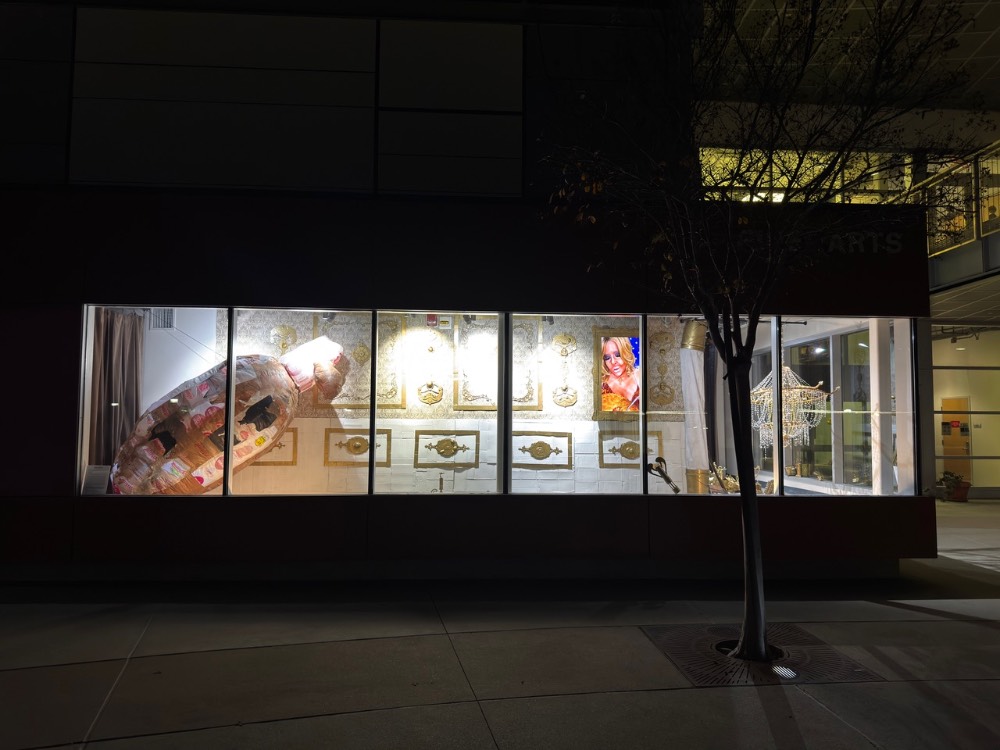 illuminated window with artwork from total winner
