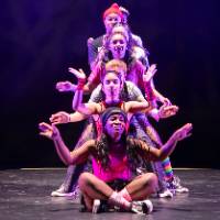 Dancers posing in a pyramid