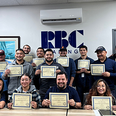 Excel training group holding certificates of completion
