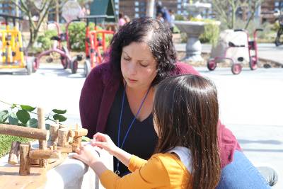 Kristina  Farah working with a child