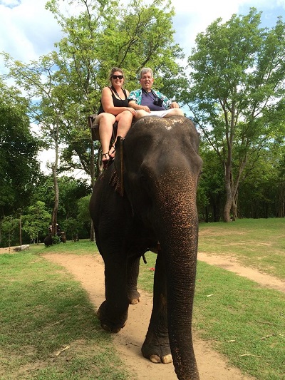 Katie and dad riding elephant