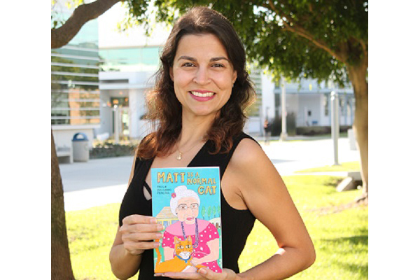 Paula Pereira with her book
