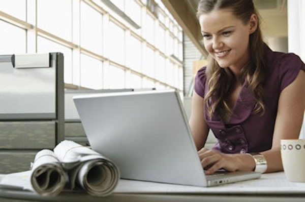 A woman in front of a laptop