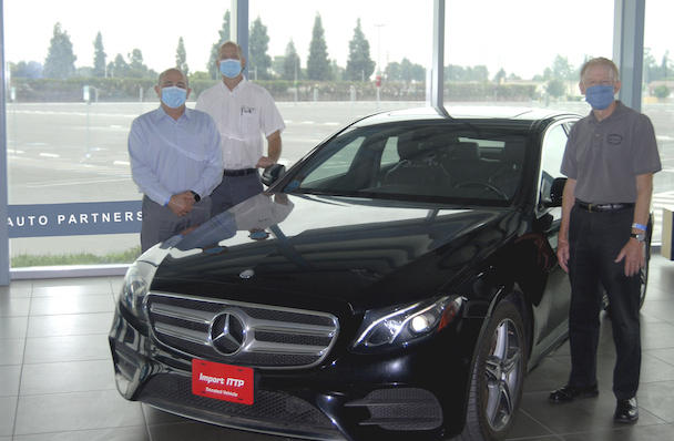 Mike Dehdashti, Dan Smith, and Leonard Glick (l-r) with E300 donation