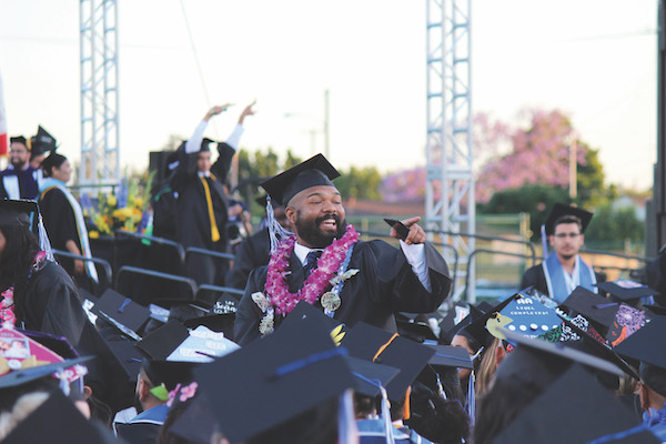 Student in cap and gown at commencement