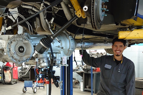 Eduardo Sierra working on a vehicle
