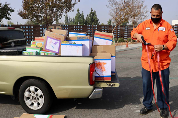 A truck with donated food and a man